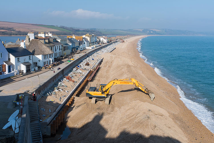 Photo of a beach being dug up