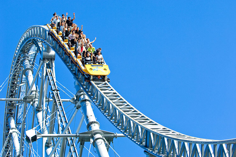 Photo of people riding a rollercoaster