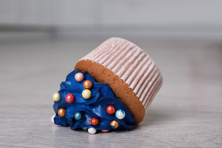 Image of a upside-down cupcake with blue frosting 