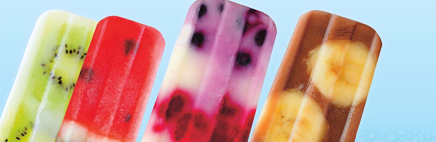 Image of four different fruit popsicles with real fruit